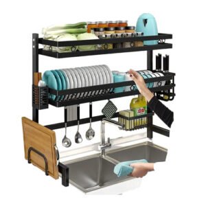 Key Features: Space-Saving Design: The double-level rack allows you to organize dishes and utensils efficiently without occupying valuable counter space. It provides two layers for drying, which helps to keep your kitchen clean and organized. Sturdy Construction: Made of high-quality stainless steel or durable materials, the rack ensures long-lasting use and resists rust or corrosion, even in a wet environment. Its strong frame supports heavy plates, bowls, glasses, and utensils. Double Layers: The top tier is designed to hold plates, bowls, and cups, while the bottom tier is perfect for drying utensils, glasses, or small items. The two tiers help in drying different items simultaneously without overcrowding, keeping everything in order. Fits Over Sink: This rack fits neatly over most standard kitchen sinks, allowing you to use the space above the sink for drying dishes. The over-the-sink design makes it easy to drip dry without needing additional counter space. Adjustable Design: Some models come with adjustable width, allowing you to customize the fit according to your sink size. This feature ensures compatibility with various sink sizes, making the dish rack highly versatile. Easy Drainage: The rack is equipped with a drainage system that channels water directly into the sink, keeping your counter dry and free of water buildup. This feature is particularly helpful in preventing countertop messes. Convenient Storage: In addition to the dish drying space, some racks include extra features like utensil holders, cutting board slots, and hooks for hanging cups or towels, offering additional storage space for your kitchen essentials. Benefits: Maximized Kitchen Space: By utilizing the space above the sink, you free up valuable counter space, giving your kitchen a more organized and efficient layout. Easy to Clean: The materials used in making these racks are easy to wipe clean, helping maintain a hygienic and neat drying area. Quick Drying: With the right angle and ventilation, dishes tend to dry faster compared to conventional countertop racks. The open design promotes airflow, ensuring faster drying and reducing moisture buildup. Durable and Rust-Proof: The stainless steel construction is designed to last, resisting rust or corrosion, even in high-moisture environments. Organized and Efficient: The double layers and designated spaces help you organize your dishes and utensils, making it easier to access them when needed and keeping them separate to avoid clutter. Conclusion: The Double Over-the-Sink Dish Rack is a great space-saving solution for any kitchen. It maximizes the use of available space, allows for faster drying, and keeps your counter clean and organized. Whether you have a small kitchen or just want to optimize your dishwashing process, this dish rack is an excellent addition to your kitchen essentials.